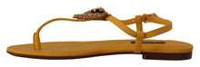 Load image into Gallery viewer, Dolce & Gabbana Mustard T-Strap Flat Sandals with Heart Embellishment
