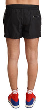 Load image into Gallery viewer, Dolce &amp; Gabbana Elegant Black KING Motive Swim Trunks
