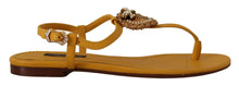 Load image into Gallery viewer, Dolce &amp; Gabbana Mustard T-Strap Flat Sandals with Heart Embellishment
