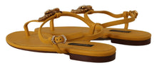 Load image into Gallery viewer, Dolce &amp; Gabbana Mustard T-Strap Flat Sandals with Heart Embellishment
